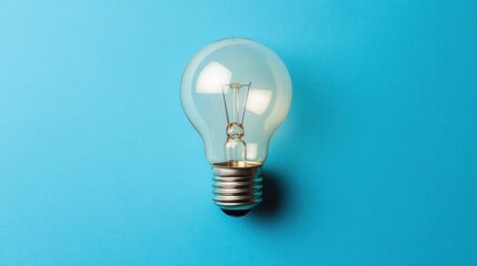 Aufkleber - clear lightbulb on blue background.