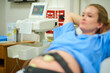 © peopleimages.com - Stomach, pregnant woman and monitor in clinic, bed and assessment for prenatal wellness on due date. Person, mother and ctg belt for belly, scan and exam with health for baby at maternity hospital