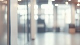 Modern office hallway, blurred background, sunlight, glass wall, interior design