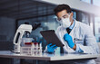 © Donson2000/peopleimages.com - Clinic, scientist and man with tablet, medical research and data collection for test results and PPE. Healthcare, person and investigation for cure of cancer, immunotheraphy and treatment in lab