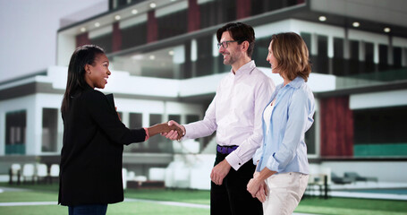 Wall Mural - Professional real estate agent shakes hands in front