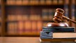 © Mr..Green - Wooden gavel rests on stack of law books on table. Legal framework update concept. Modern challenges require policy updates, new legal measures. Books signify updated legal provisions.