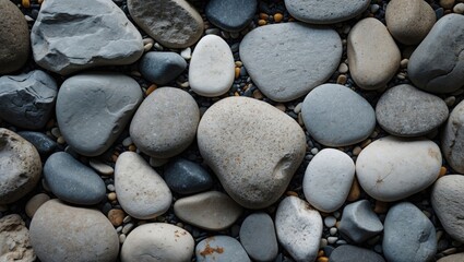 Poster - various shapes and sizes of smooth river stones in natural colors arranged on a surface