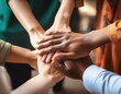 © PhotoHiru - group of hands on top of each other showing teamwork and collaboration