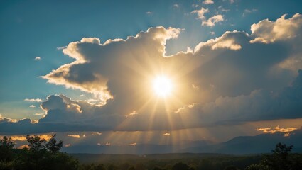Aufkleber - Sunlight breaking through clouds with rays illuminating a landscape during the golden hour in a mountainous region.