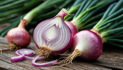 Poster - Freshly cut red onions with whole onions on wooden surface, showcasing cross-section revealing layers and roots, green onion tops in background.