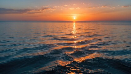 Aufkleber - sunset over calm ocean water with reflections creating a gradient of orange and blue hues in the sky and water surface