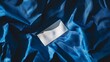 © Thanayut - elegant white business card on blue fabric background