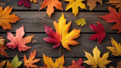 Poster - Vibrant autumn leaves in various colors spread across a rustic wooden background creating a warm seasonal ambiance.