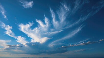 Poster - Stunning Cirrus Clouds Forming Artistic Patterns in a Clear Blue Sky Captured in a Serene Natural Landscape