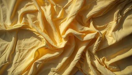 Poster - Wrinkled yellow fabric texture background with soft folds and shadows creating depth and dimension in the material