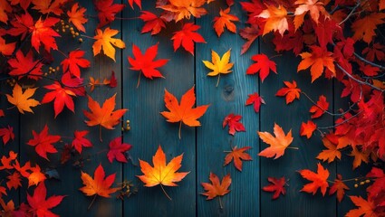 Poster - autumn leaves in vibrant colors of red orange and yellow scattered on dark wooden background