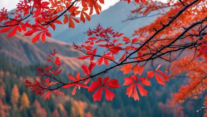 Poster - Vibrant red autumn leaves on branches against mountainous landscape with blurred forest in background during fall season