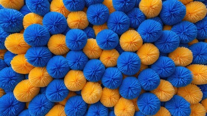 Poster - Colorful arrangement of blue and yellow decorative pom poms textured background for crafts and design concepts