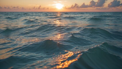 Poster - calm ocean waves reflecting sunset light under a colorful sky with clouds in the distance