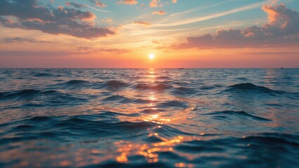 Poster - Vibrant sunset over ocean horizon with colorful sky and reflective water surface creating calm atmosphere and natural beauty