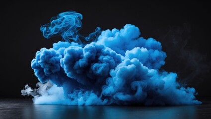Wall Mural - dense blue smoke cloud billowing on a dark background creating an atmospheric and dramatic visual ef