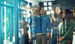 © peopleimages.com - Woman, group and glass wall with writing at office, startup or review for ideas, charts or budget in meeting. Business people, brainstorming and notes on board, planning and graphs for revenue at job