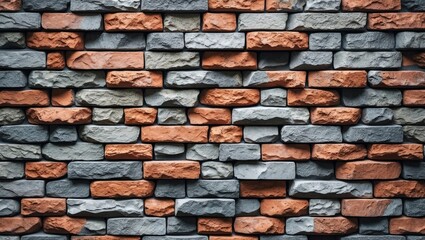 Poster - textured wall made of interlocked gray and orange bricks in a rustic appearance