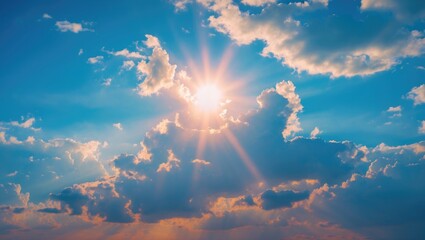 Poster - bright sun shining through fluffy white clouds against a blue sky with scattered clouds and rays of 