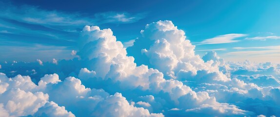 Wall Mural - fluffy white clouds in a bright blue sky with light wispy trails and a serene atmosphere suitable fo
