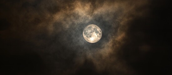 Aufkleber - Moon partially obscured by thick, dark clouds; soft glow illuminates the sky, creating a serene, mysterious night ambiance with hues of gray and white.