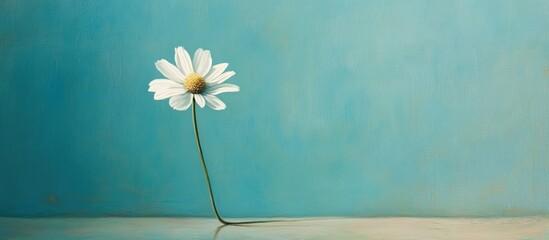 Aufkleber - Solitary white chamomile flower positioned left with a green stem against a tranquil blue background emphasizing its natural beauty and isolation.