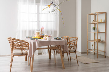 Wall Mural - Beautiful table setting for Easter cakes and eggs in dining room