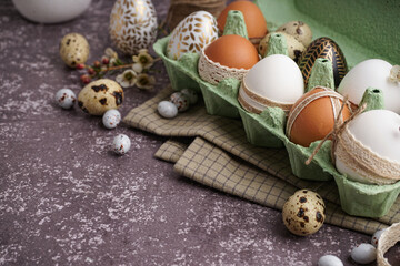 Wall Mural - Paper holder with traditional decorated Easter eggs and spring flowers on grunge background