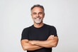 © ant - Smiling middle aged man with his arms crossed, wearing a black t shirt on white background.
