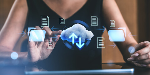 Fototapete - Woman interacting with cloud storage interface on digital screen.