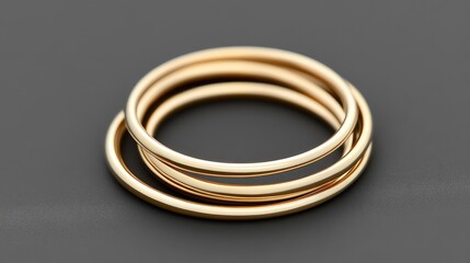 Poster - Thin minimalist gold rings stacked together, placed on a modern dark gray background. No text, no people.