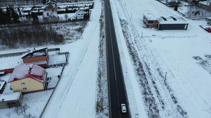 Canvas Print - Aerial view snowy rural road winter