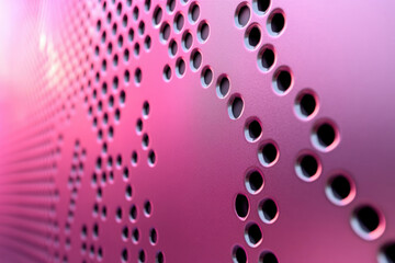 Poster - Pink metallic surface with a pattern of evenly spaced circular holes.