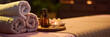 © AnnaStills - Website banner of three towel rolls, oval tray with jar filled with essential oil and lit tea candle