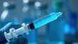 © Hordina Anastasia  - A close-up of a syringe with a vaccine inside, medical environment, medicines and the fight against diseases, epidemics and pandemics