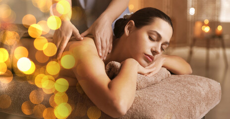 Wall Mural - Woman receiving back massage in spa salon, bokeh effect. Banner design