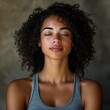 © Kumail - Serene Woman Meditating: Close-up Portrait with Curly Hair