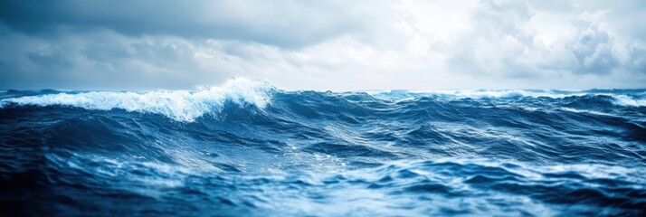 Poster - Waves roll over the deep blue ocean under a cloudy sky during an overcast afternoon. Generative AI