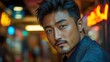© NicotineLens  - Confident Asian Man in City Lights - Portrait