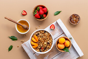 Wall Mural - Top view of breakfast with oatmeal granola and ingredients. Healthy morning routine