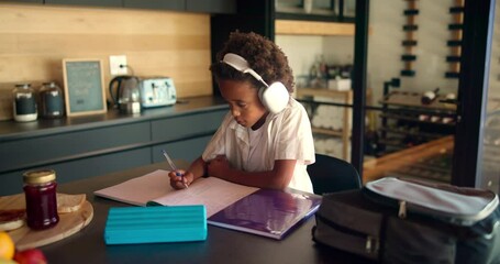 Poster - Homework, headphones and child with books writing for remote learning, education and lesson. School, development and African boy in home listening to audio for studying, knowledge and development