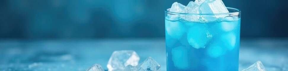  icy blue ice dawet mixture in a cylindrical glass, cylindrical container, sweet indulgence