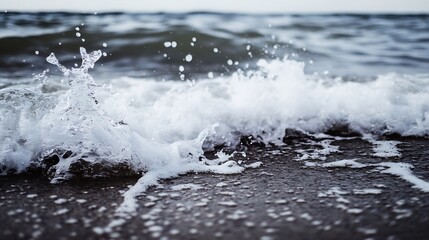 Leinwandbilder - Dynamic Ocean Wave Splashing Against the Sandy Shore Under a Cloudy Sky : Generative AI