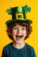 Wall Mural - Young boy laughing in a bright yellow background, wearing green shamrock-patterned hat with gold glitter, celebrating St Patrick's Day