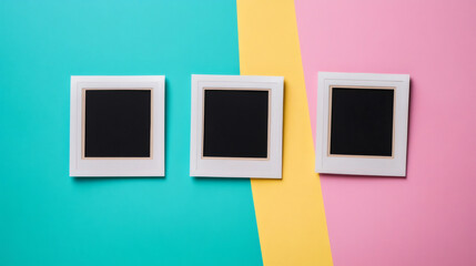 Aufkleber - White photo frames hanging against multicolored wall backdrop, creating visual contrast with blank space for personalized photography display