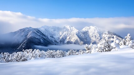 Wall Mural - Stunning snowy mountain landscape under clear blue sky with mist lingering in the valleys : Generative AI