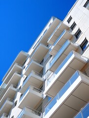 Wall Mural - Modern Architecture of Residential Building with Stylish Balconies Against Bright Blue Sky : Generative AI