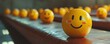 © Влада Яковенко - Cheerful yellow smiley faces aligned on wooden surface in a row with blurred background