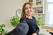 © Valerii Honcharuk - Close-up selfie portrait of young cheerful woman looking at web camera